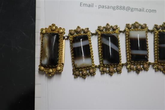 Two banded agate bracelets, one in gilt metal, one in white metal.